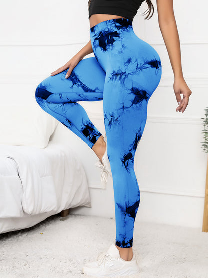 High waist scrunch leggings in blue tie-dye design, offering compression fit and tummy control for women’s activewear needs.