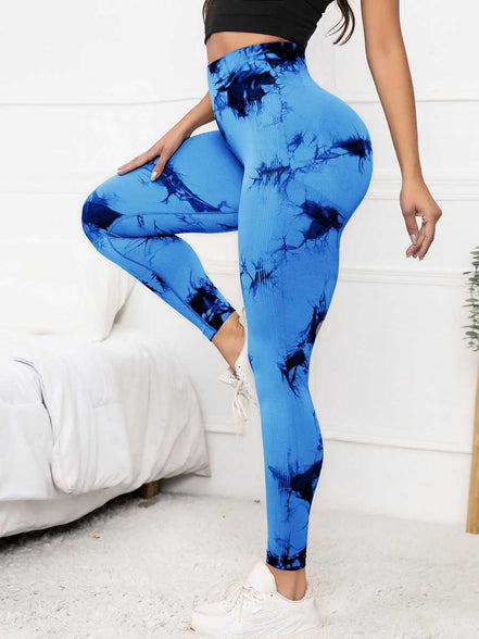 High waist scrunch leggings in blue tie-dye design, offering compression fit and tummy control for women’s activewear needs.