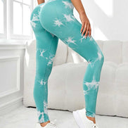 High waist scrunch leggings women in teal tie-dye design with compression fit. Offers tummy control and sculpting for activewear and fitness use.