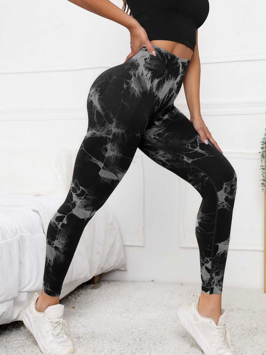 Black scrunch leggings with high waist and tummy control, featuring a stylish tie-dye pattern for activewear and gym performance.