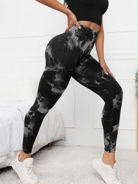 Black scrunch leggings with high waist and tummy control, featuring a stylish tie-dye pattern for activewear and gym performance.