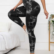 High waist scrunch leggings in black with tie-dye pattern, designed for tummy control and flattering fit during activewear sessions.