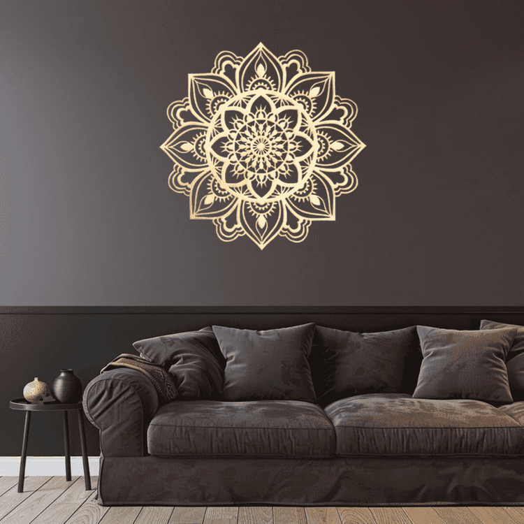 Decorative mandala wall sticker on a dark wall above a brown sofa.