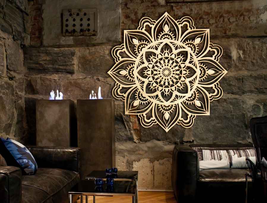 Decorative mandala wall art in a living room with stone walls and furniture.