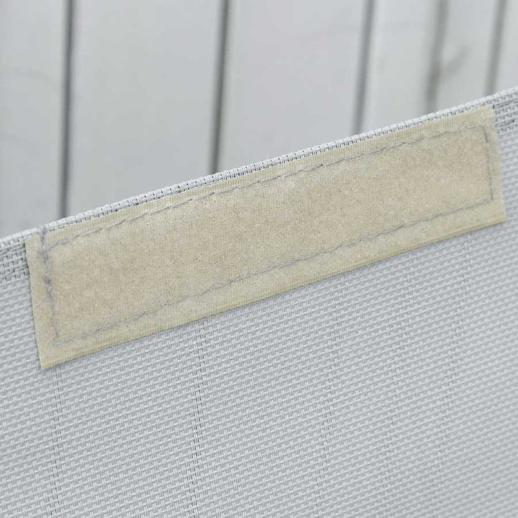 Detail of woven outdoor furniture material with beige backing