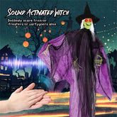 Halloween decoration of a sound-activated witch with a hand triggering it.