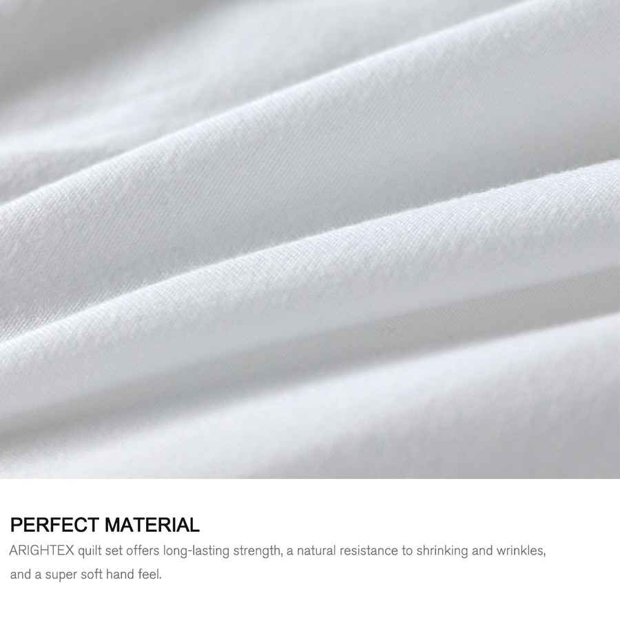 Close-up of white quilt fabric with text about quilt set material