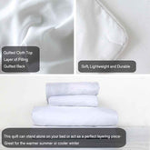 White quilt with quilted top and back layers, soft and durable, suitable for bedding.
