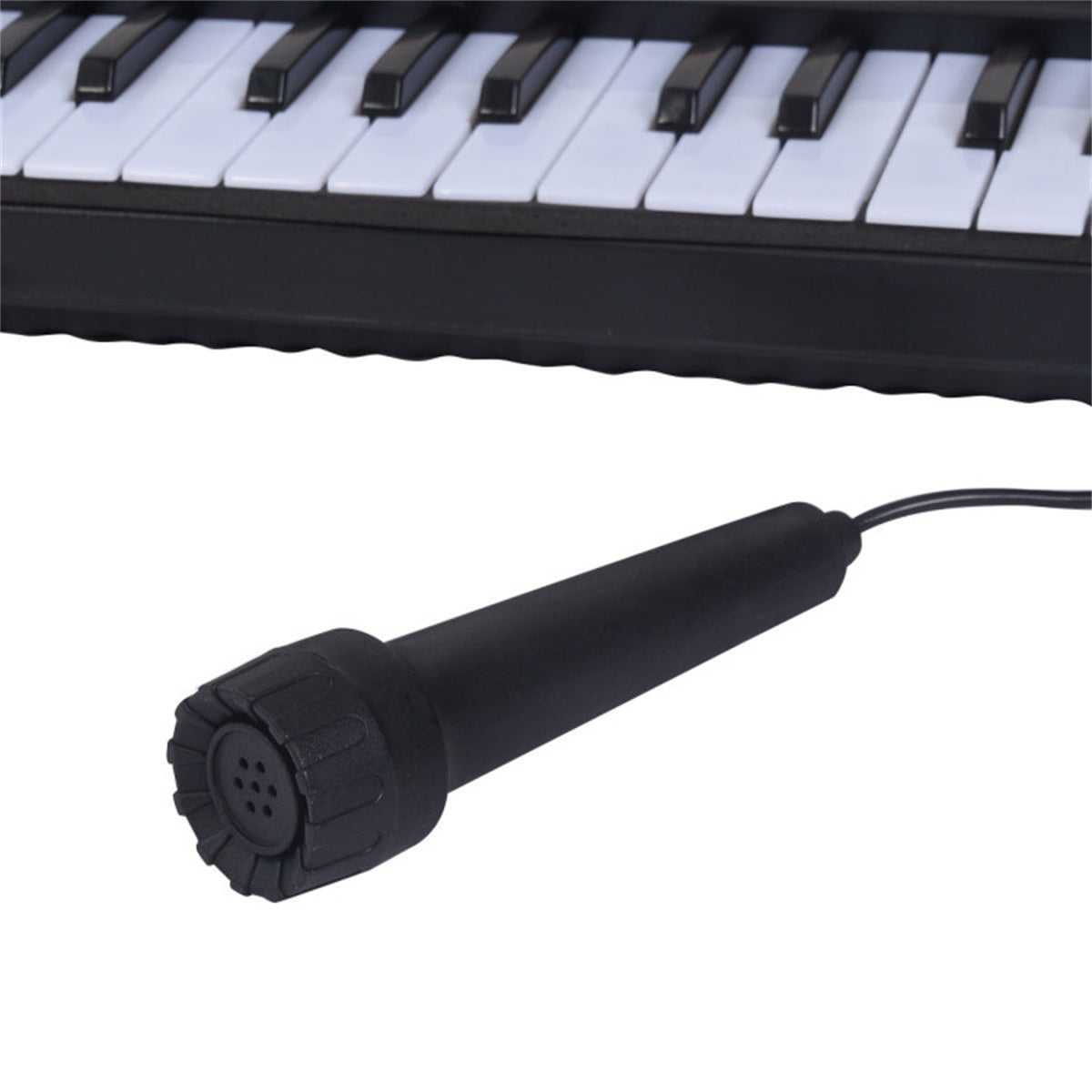 Close-up of included microphone for 54-Key Electronic Keyboard for Kids, enhancing interactive music experiences.