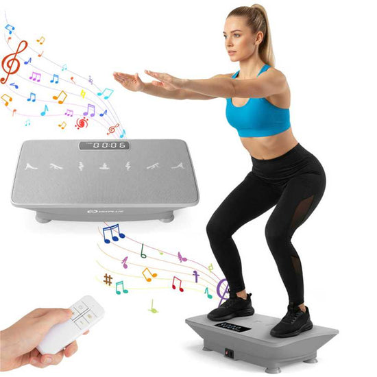 Woman exercising on gray full body vibration plate with remote control and colorful musical notes