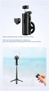 A black detachable Bluetooth wireless remote control for a selfie stick or phone tripod, shown with a phone mount and a tripod stand. The top section shows the remote and mount separated on a pale blue background with descriptive text, and the bottom section shows the assembled tripod with a hand holding the remote in front of a soft blue beach-like backdrop.