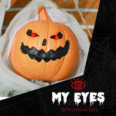 Halloween-themed decorative pumpkin with glowing eyes and mouth on a black background with spider web design.