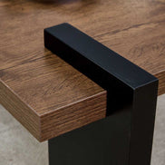 Detail of black leg joint on Modern Walnut Coffee Table - MDF Style, highlighting sturdy construction and clean lines.