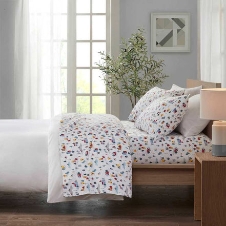 3 PCS Twin XL Printed Sheet Set with White Village Print on a neatly made bed in a bright bedroom, ideal for student dorms or guest rooms.