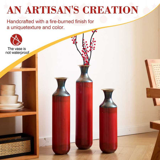 Handcrafted droplet shaped metal floor vases with fire-burned finish, displayed in a cozy home setting for decorative use.