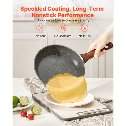 Nonstick frying pan flipping crepe, highlighting speckled coating and PFOA-free performance from skillet set.