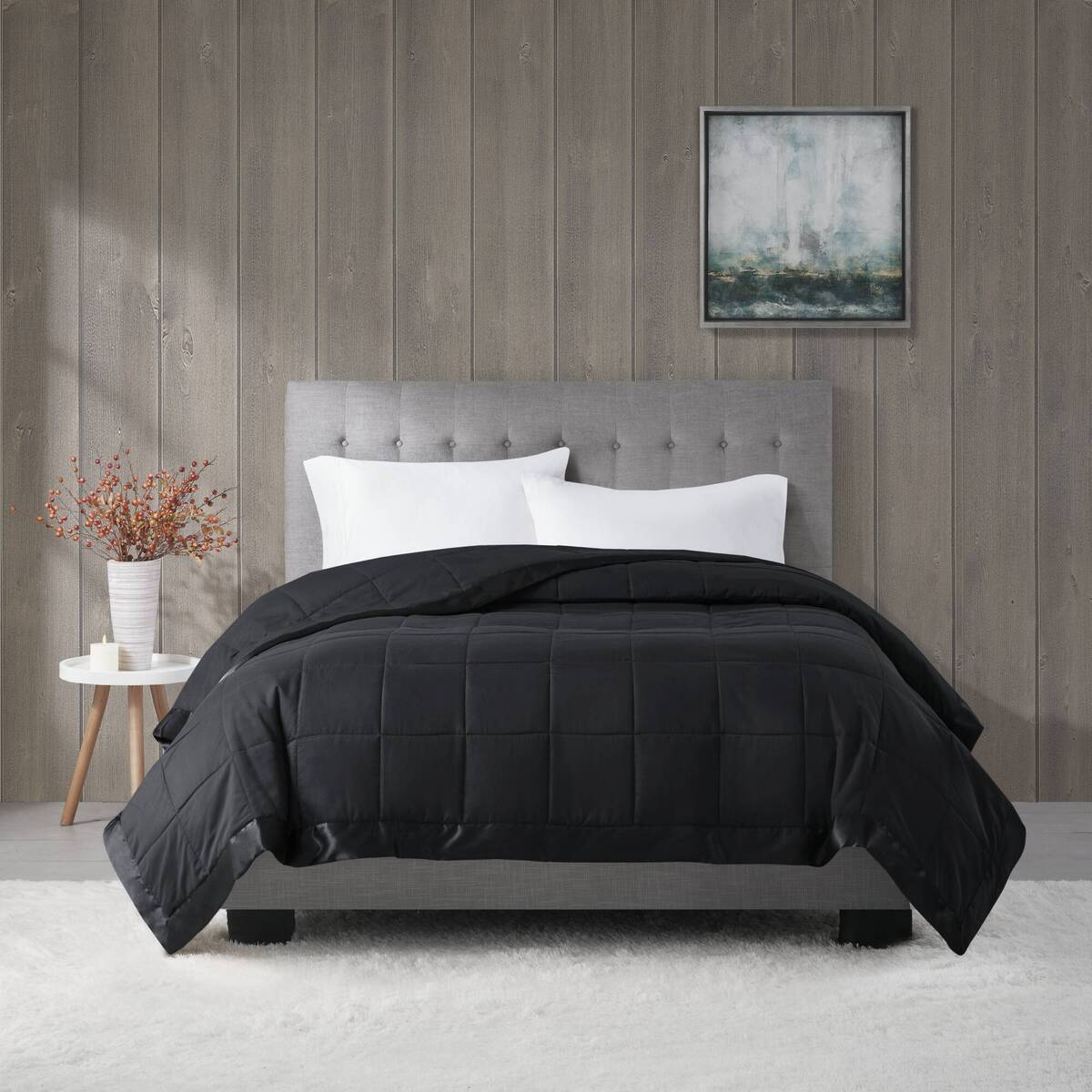 Black Lightweight Down Alternative Blanket on a bed in a cozy room setting, perfect for enhancing comfort and modern bedroom style.
