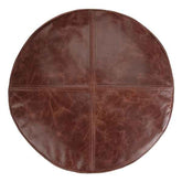 Round brown leather mat on a white background