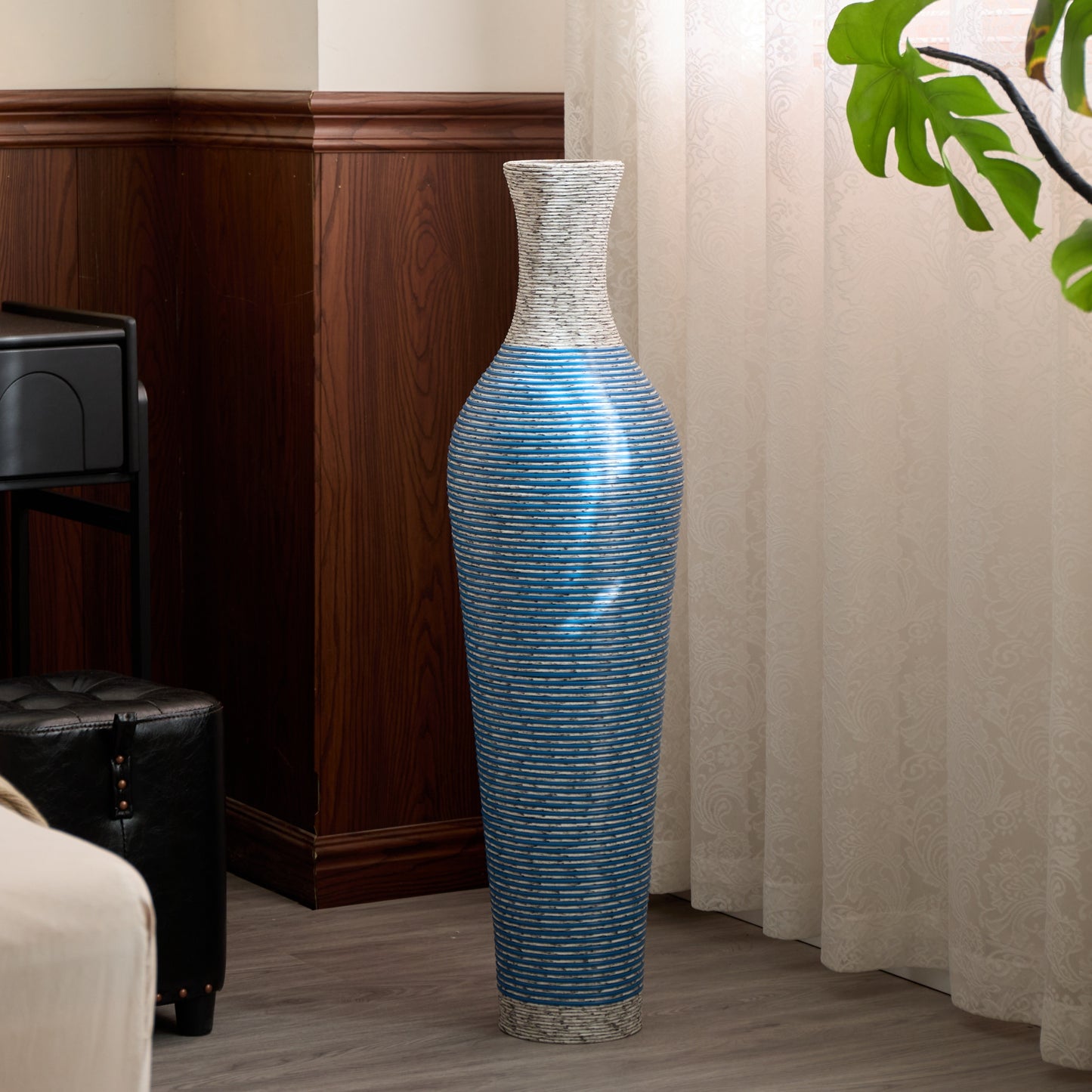 Glossy blue 39-inch floor vase decor in a softly lit bedroom corner, adding a modern accent to home decor.