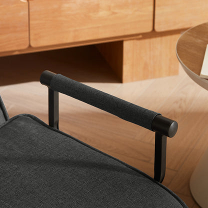 Close-up of padded armrest on the Convertible Sofa Bed Chair, showing comfort-focused design and durable black linen fabric.