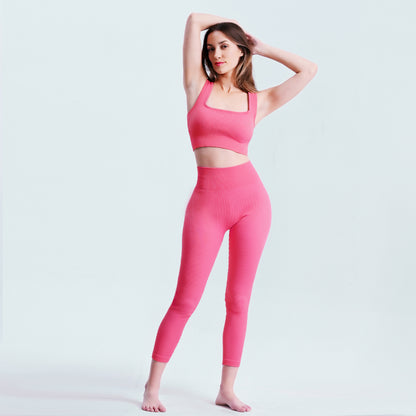 Model wearing Seamless Tummy Control Yoga Pants in pink with matching sports bra, showcasing full activewear set for women.