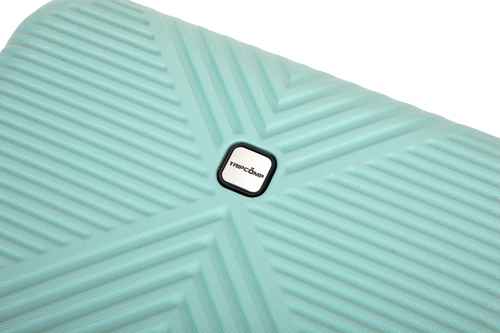 A close-up of a mint green textured suitcase or luggage piece with a central black and white Marc bane logo, set against a plain white background.