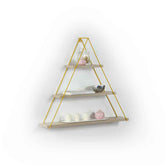 Triangular wall shelf with gold frame and decorative items on a white background