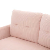 Close-up of a pink corduroy sofa with a white background