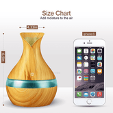Wooden diffuser with size chart next to an iPhone 6