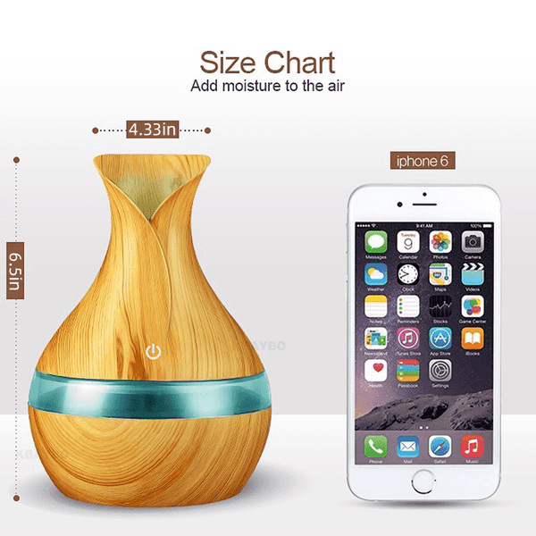 Wooden diffuser with size chart next to an iPhone 6
