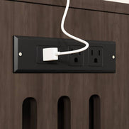 Built-in charging station with power outlets on the cat litter box enclosure, ideal for organizing electronics.