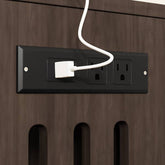 Built-in charging station with power outlets on the cat litter box enclosure, ideal for organizing electronics.