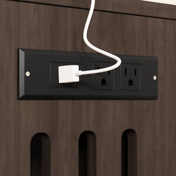 Built-in charging station with power outlets on the cat litter box enclosure, ideal for organizing electronics.