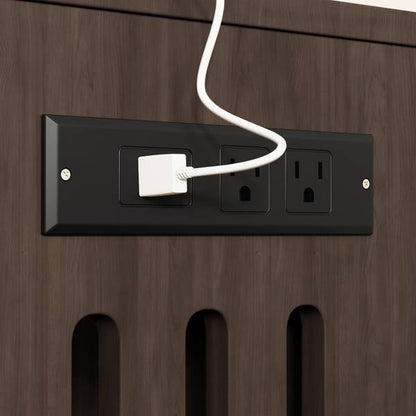 Built-in charging station with power outlets on the cat litter box enclosure, ideal for organizing electronics.