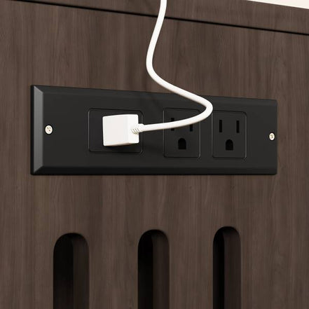 Built-in charging station with power outlets on the cat litter box enclosure, ideal for organizing electronics.