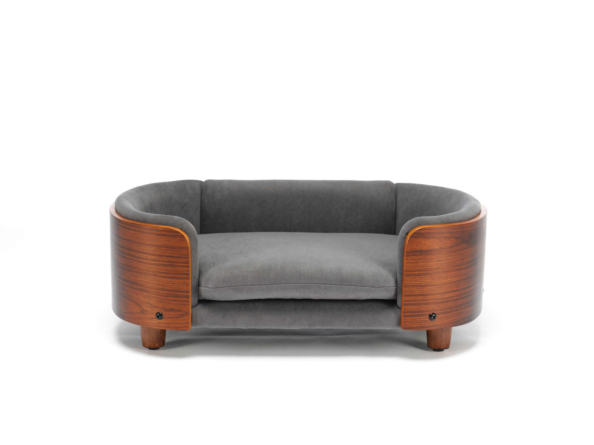 Front view of small Scandinavian Elevated Dog Bed featuring a curved solid wood frame and plush grey velvet cushion for luxury pet lounging.