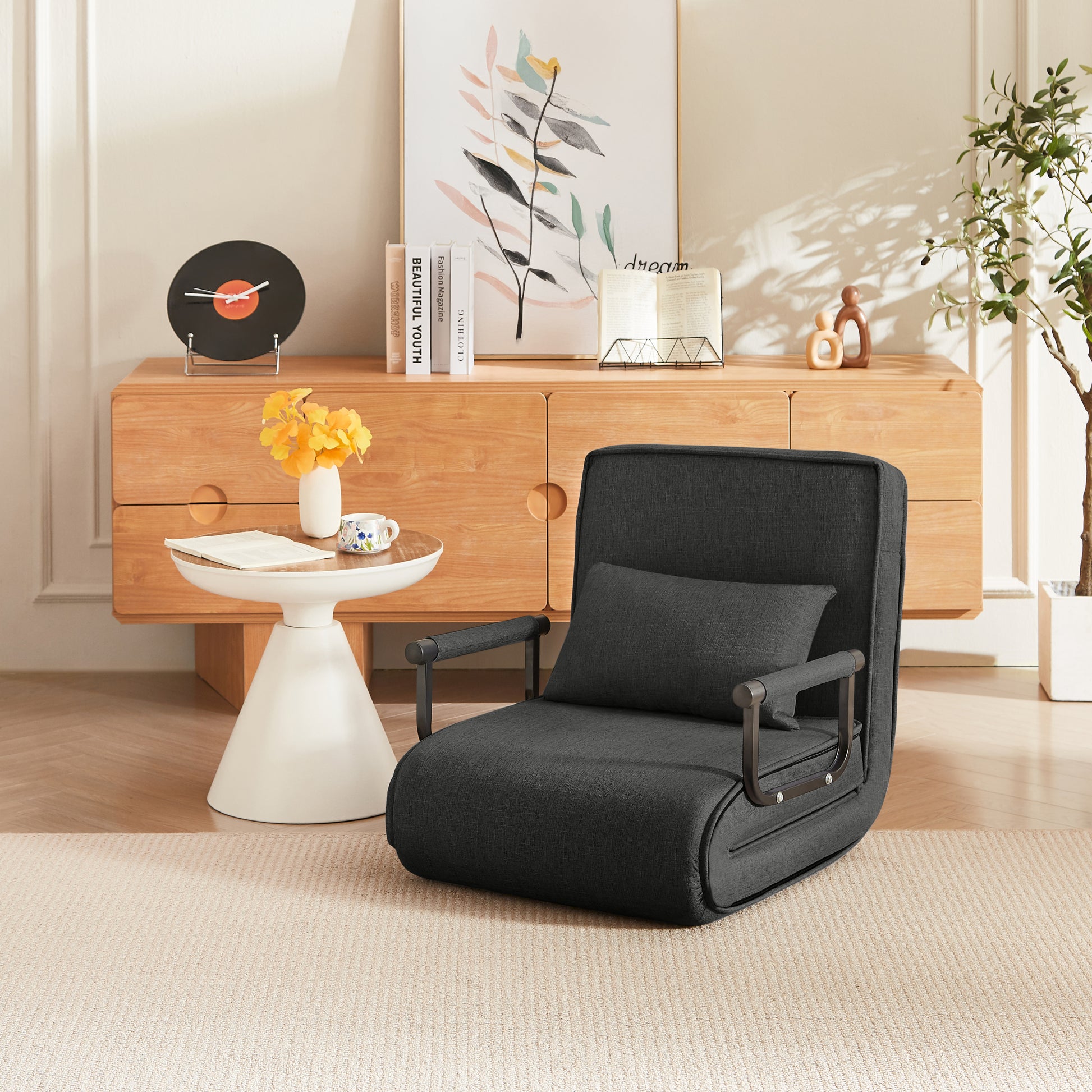 Sleep Chair Bed in black linen shown without legs extended, demonstrating its compact folding design for small living areas.