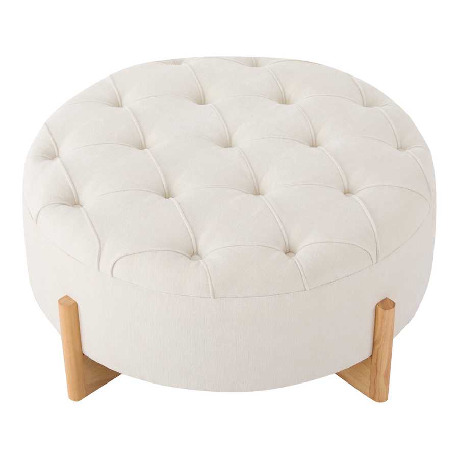 Round ottoman with tufted white cushion and wooden legs on a white background