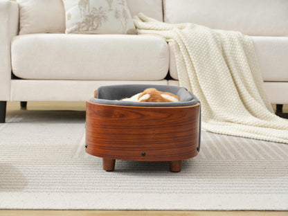 Rear view of Scandinavian Elevated Dog Bed featuring curved solid wood frame and elevated legs for airflow and support.
