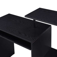 Detail of black wood and white storage box on open shelving of computer desk