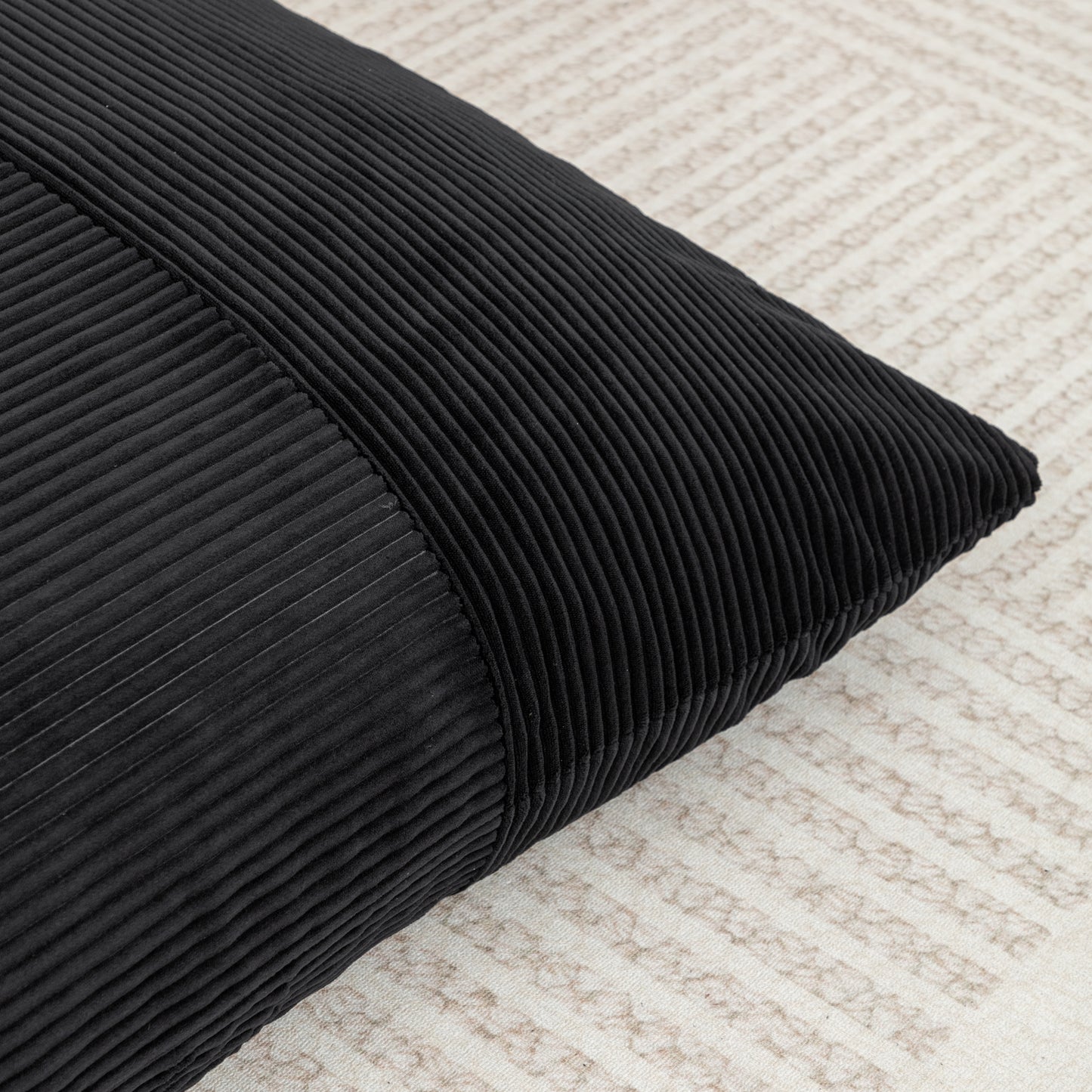 Corner detail of Corduroy Bean Bag Chair in black, showing plush padding and ribbed fabric texture for modern interiors.