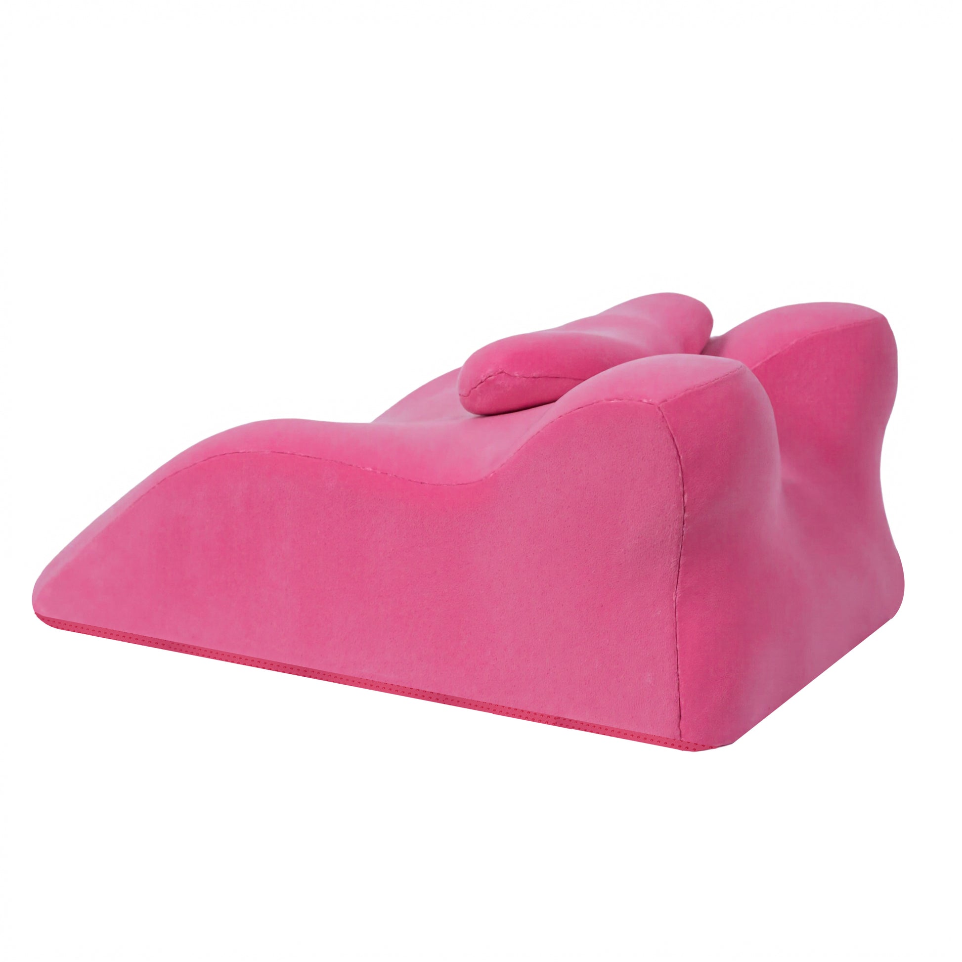 Angled view of pink memory foam posture support pillow with ergonomic curves for multi-position comfort and spinal alignment.