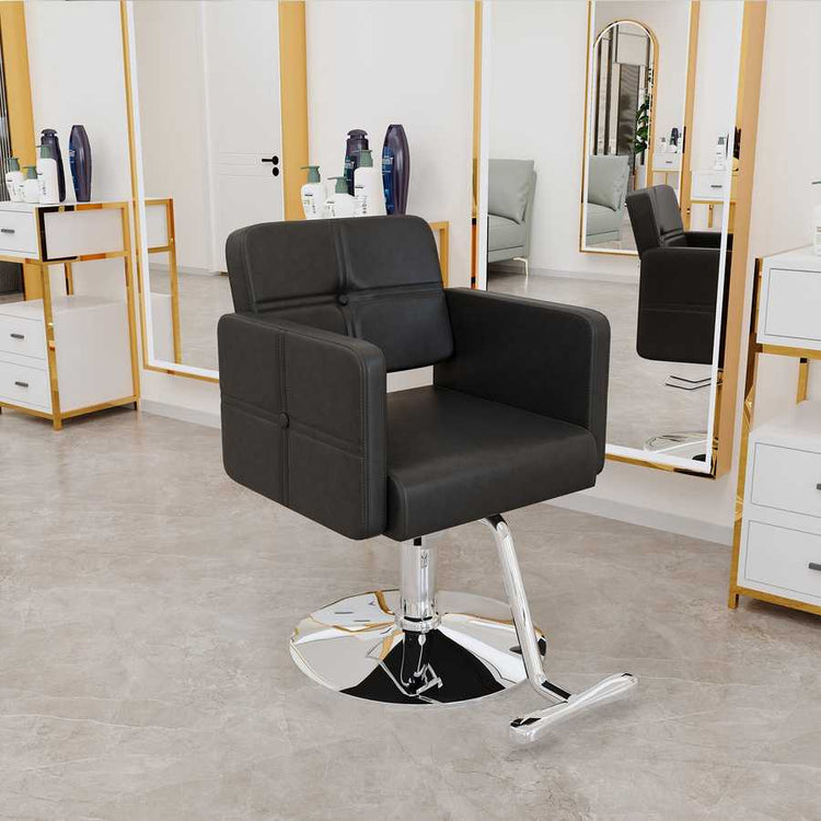 Black salon chair with adjustable height in modern salon