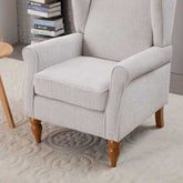 Gray armchair with wooden legs in a room setting