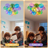 Colorful bubble light fixture in a room with children playing.