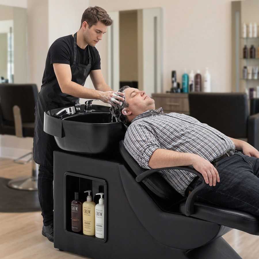 Barber washing station with shampoo and conditioner bottles