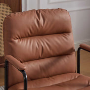 Close-up of the backrest on brown ergonomic office chair showing plush cushioning and faux leather texture. Enhances back support and style.