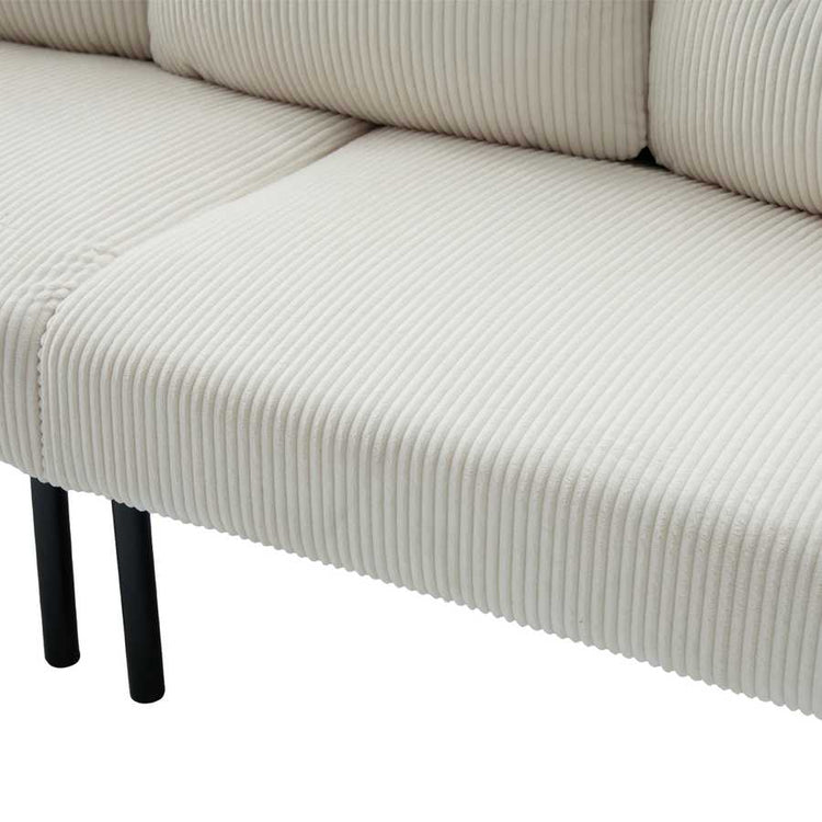 Close-up of a beige ribbed sofa with black legs on a white background