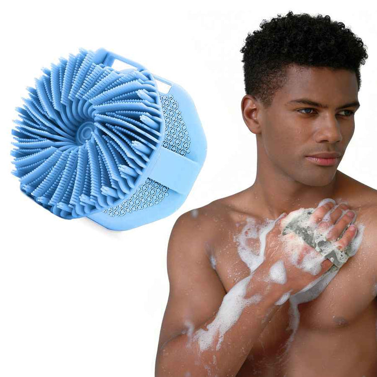 Man using a blue silicone scrubber on his arm with a white background