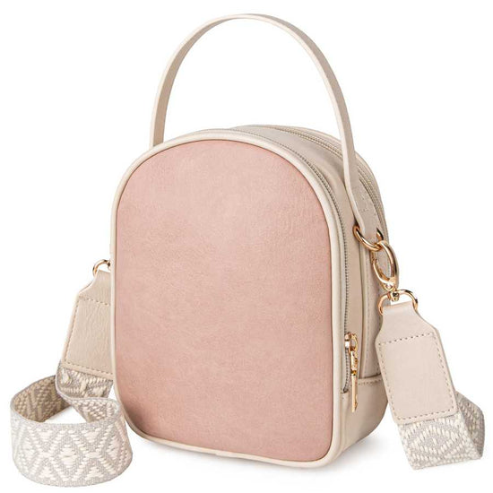 Pink crossbody bag with beige strap on a white background